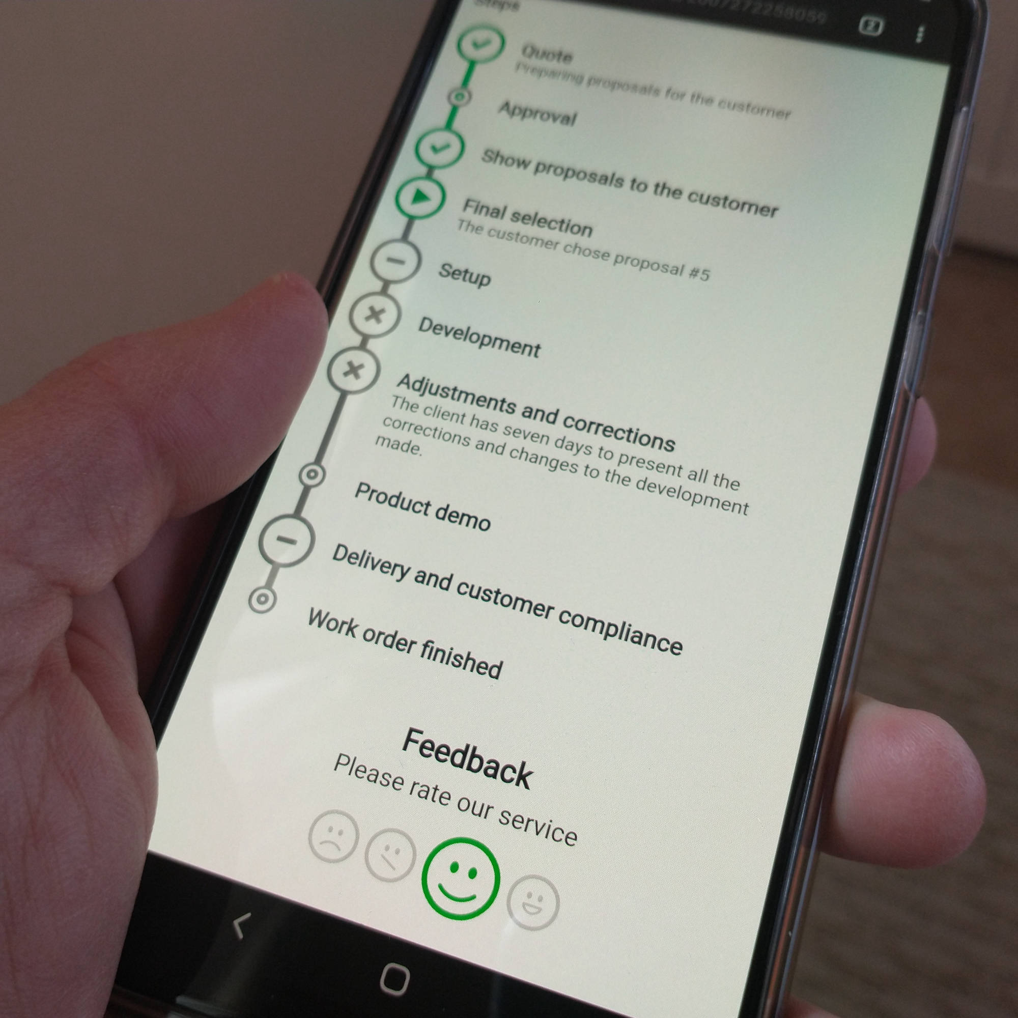 A customer holding his smartphone displaying a Tuaris document